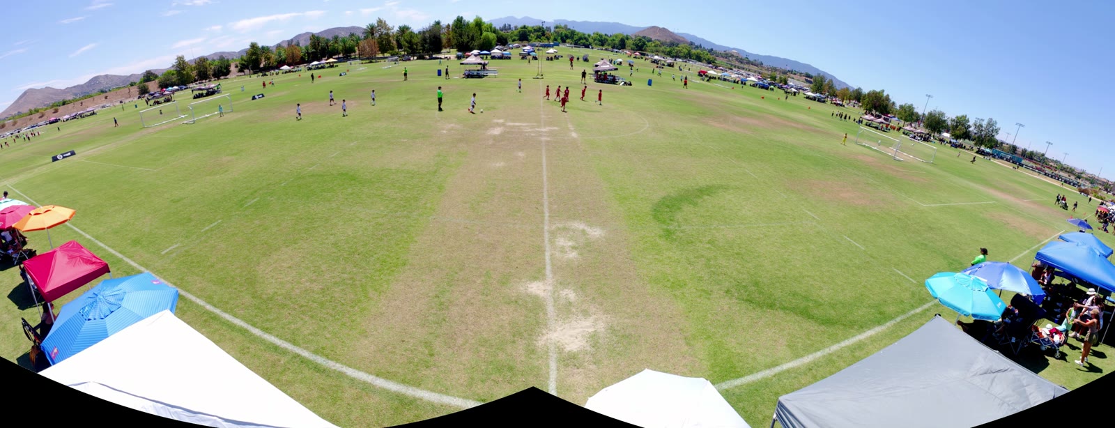 A full stitched panorama of a soccer field, produced from two overlapping camera recordings